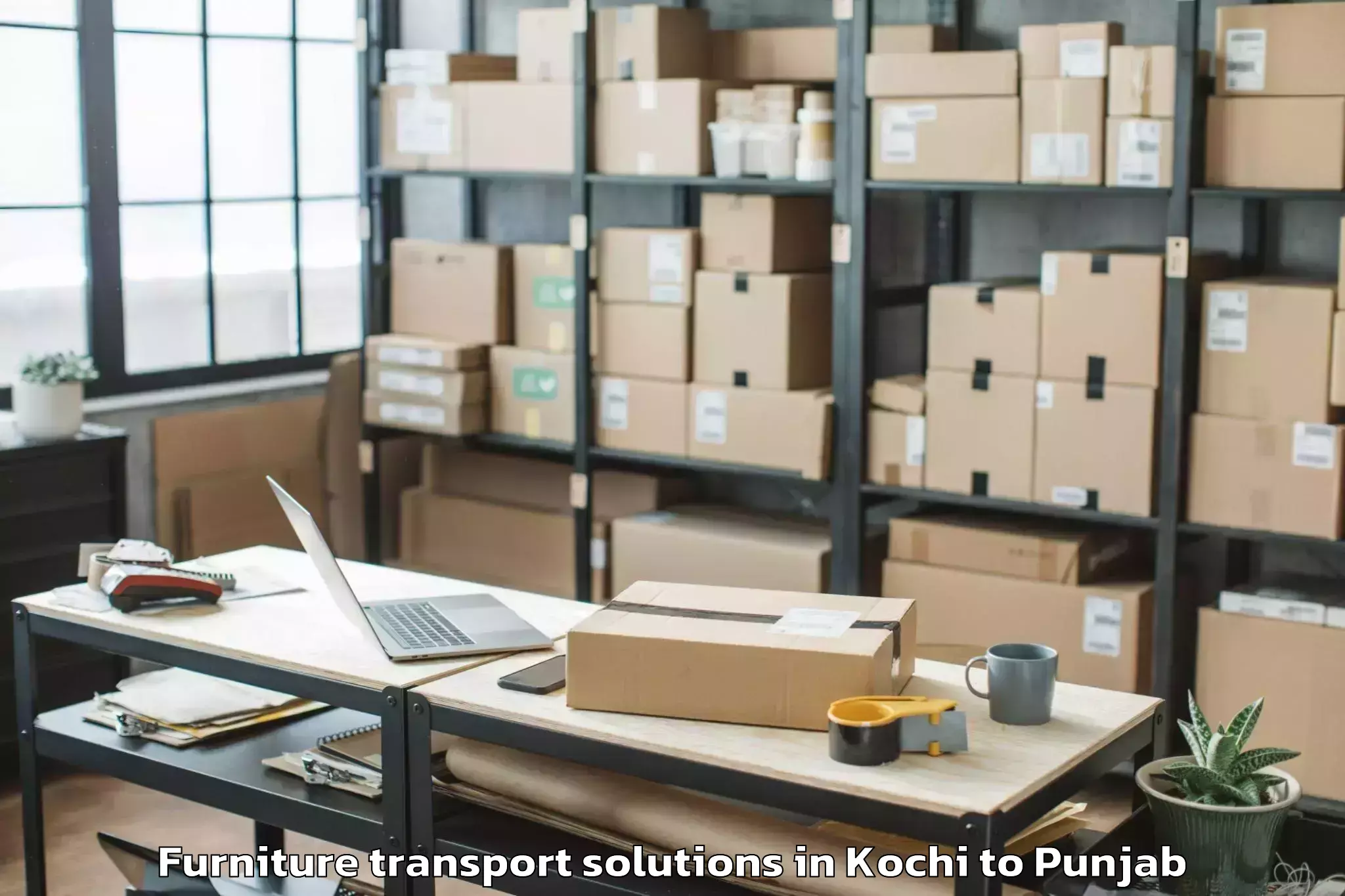 Book Kochi to Moga Furniture Transport Solutions